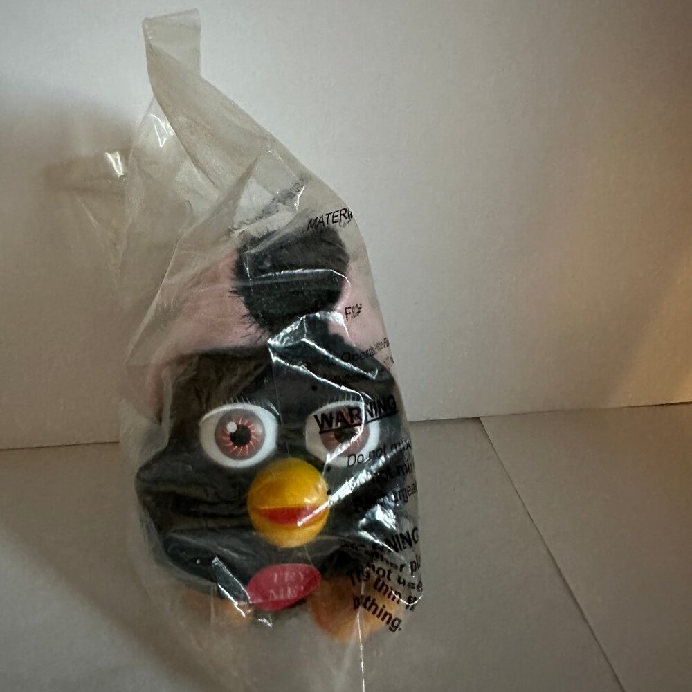 Black furby clip-on with tags.  Still in bag.  Tags still on.
